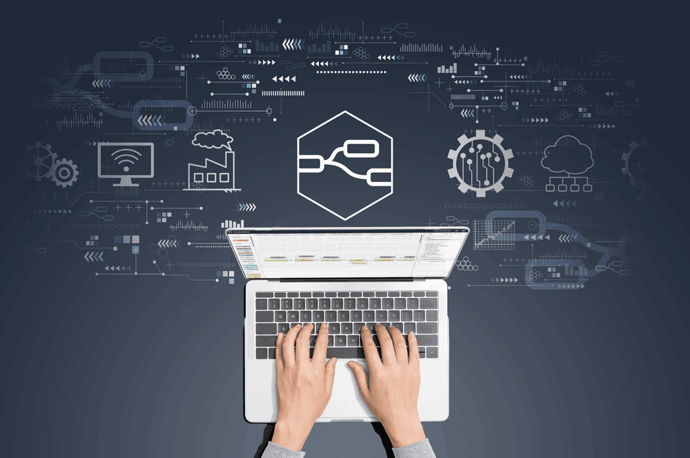 Image of hands typing on laptop working on Node-RED flows